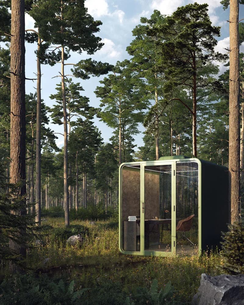 Thinktanks Backyard Office Pod XL rendered in a pine forest clearing with a desk and chair inside